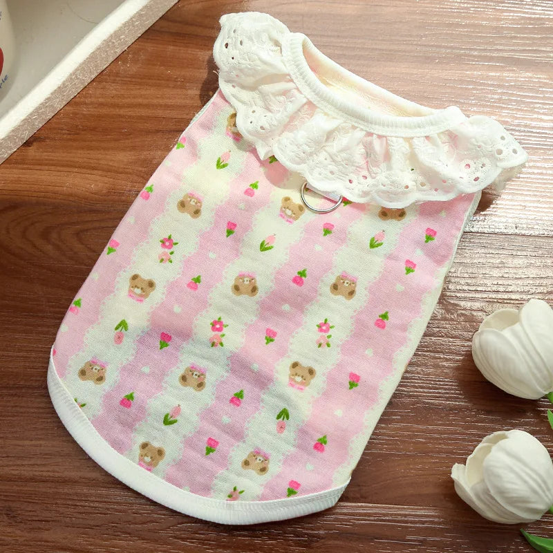 Pink cotton dog vest with a white lace collar and a pattern of cartoon bears and pink leaves.