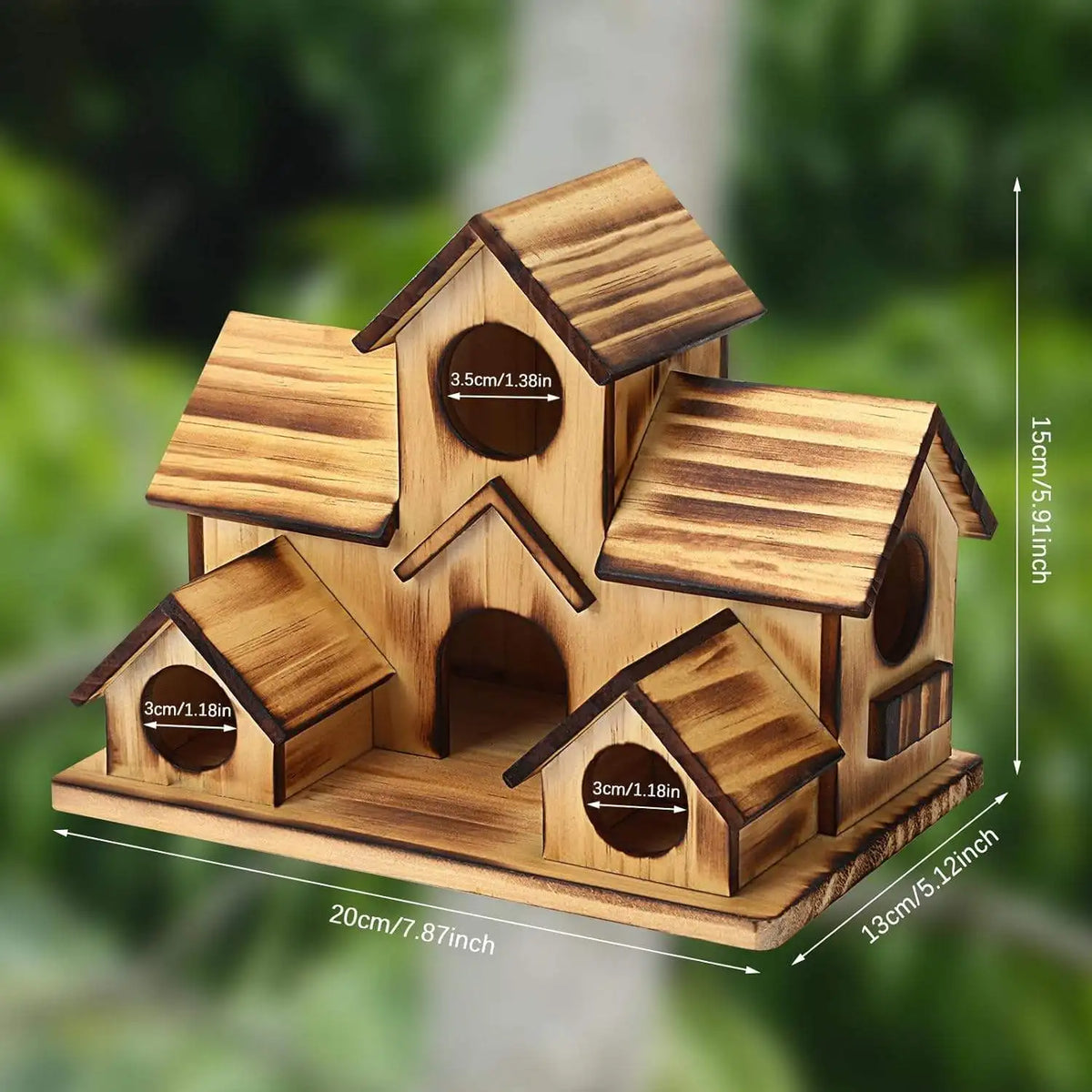 Handmade wooden bird house with a pitched roof and entrance holes, made of natural wood.