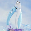 A light blue professional pet nail clipper is shown against a blurred background of ice and purple foliage.