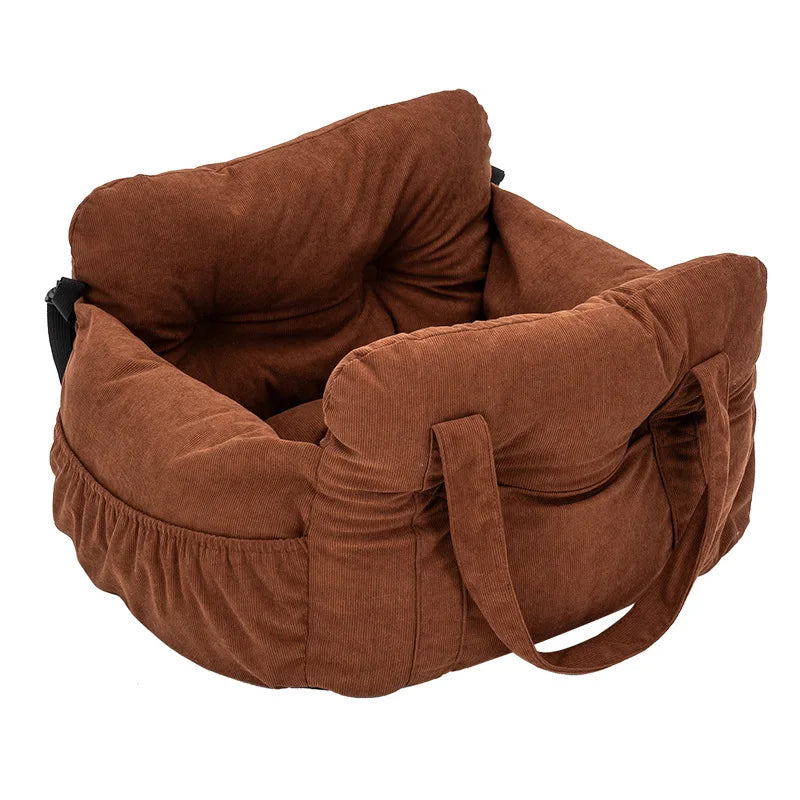 A brown durable pet car seat with safety straps shown from the side.