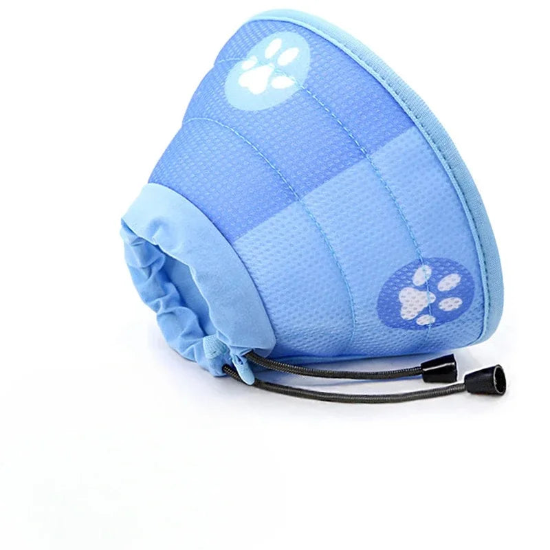 A light blue adjustable recovery collar for cats with a paw print design.