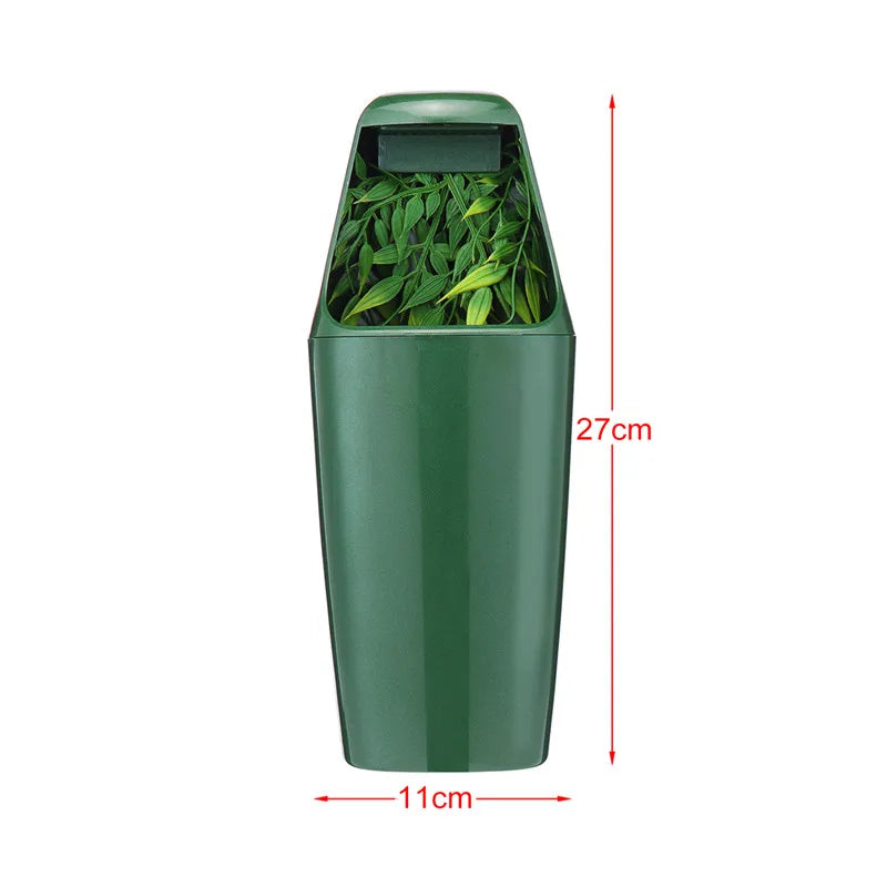 A tall, dark green reptile drinking water filter fountain with a rectangular opening for water.