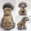 A classic tan PU leather dog jacket for a poodle-type dog, shown in a full-body view.