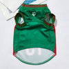 A green and red breathable mesh sport dog jersey with a white paw print detail.