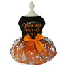 A black top and orange tulle dress for a dog featuring a gold text design and an orange bow.