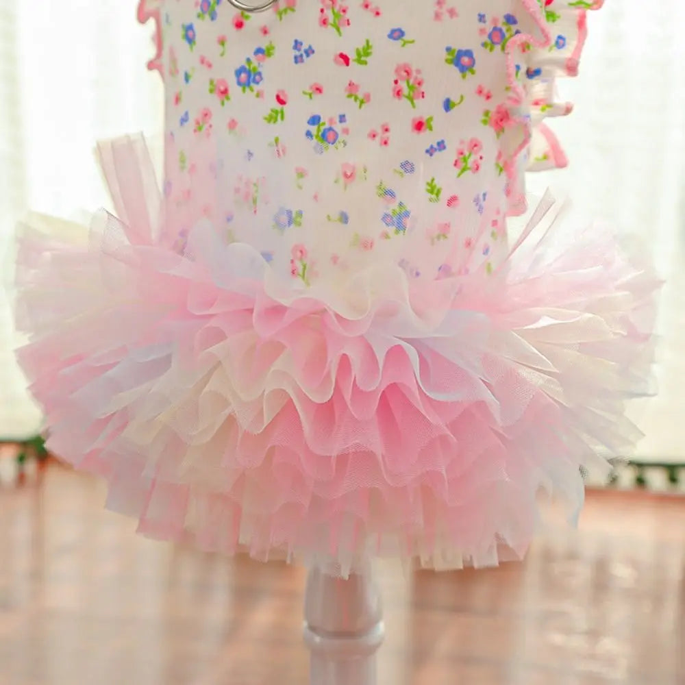 A pink floral princess pet dress for dogs and cats with ruffled tiers.