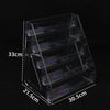 A clear acrylic display stand with three tiers for holding business cards and brochures.