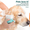 A hand is using a teal silicone pet bath massage brush with foam maker on a dog's head.