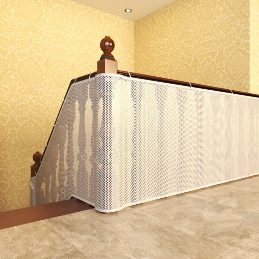 A white perforated safety net railing installed on a balcony or stairs, featuring wooden posts and a dark top rail.