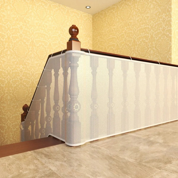 A white perforated safety net railing installed on a balcony or stairs, featuring wooden posts and a dark top rail.