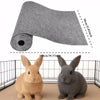 A roll of self-adhesive cat scratch pad material next to two gray and tan rabbits.