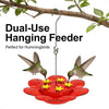 A dual-use hanging feeder with a hook and suction cup, featuring a red flower base for hummingbirds.