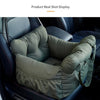 A green durable pet car seat with safety straps is shown installed in a car interior.