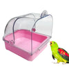 Clear plastic external bird bath with a pink base for parakeets and birds.