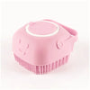 A pink silicone pet bathing massage glove with a rounded head and bristles.