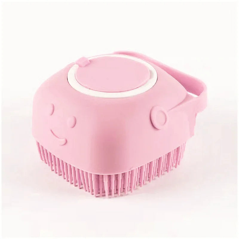 A pink silicone pet bathing massage glove with a rounded head and bristles.