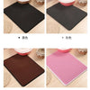 Four variations of double-layer cat litter mats in black, pink, maroon, and beige colors shown with surrounding litter bowls.