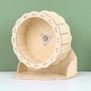 A natural wooden hamster house and activity platform with a circular opening.