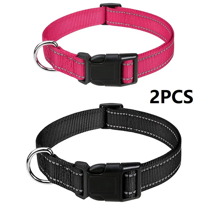 Two black nylon dog collars with buckles shown against a white background.