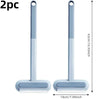 A pair of light blue pet hair remover brushes with a self-cleaning base shown vertically and horizontally.