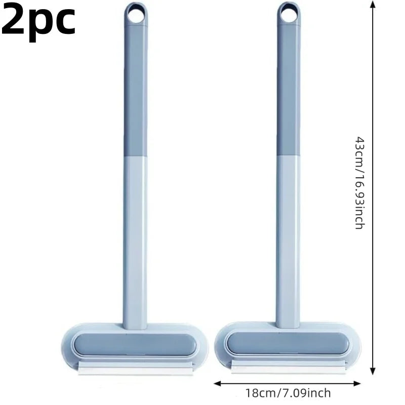 A pair of light blue pet hair remover brushes with a self-cleaning base shown vertically and horizontally.