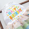White birthday suit for dogs made of tulle with colorful lettering
