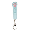 Light blue pet laser pointer toy with a pink paw shape and a metal clip.