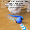 A blue, textured cat toy with an LED light is shown on a wooden floor, stimulating a cat's hunting instinct.