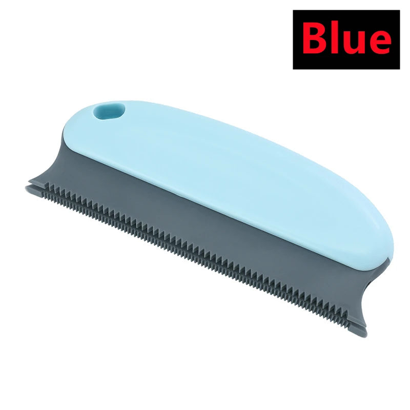 A blue portable lint and pet hair remover brush with a gray body and serrated bristles.