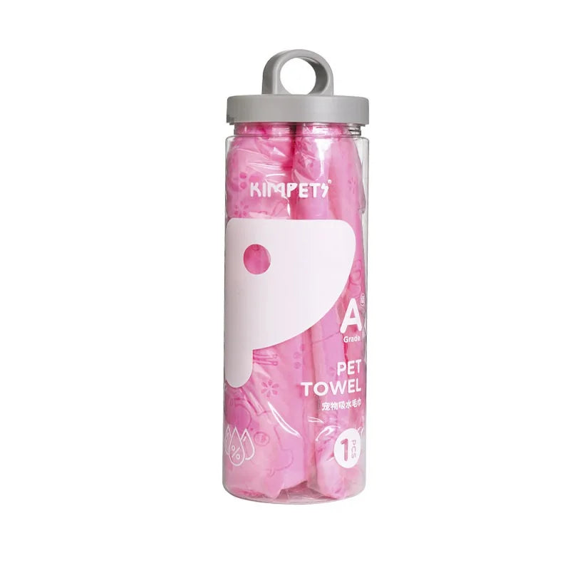 A clear storage bucket filled with pink pet towels for dog bathing.