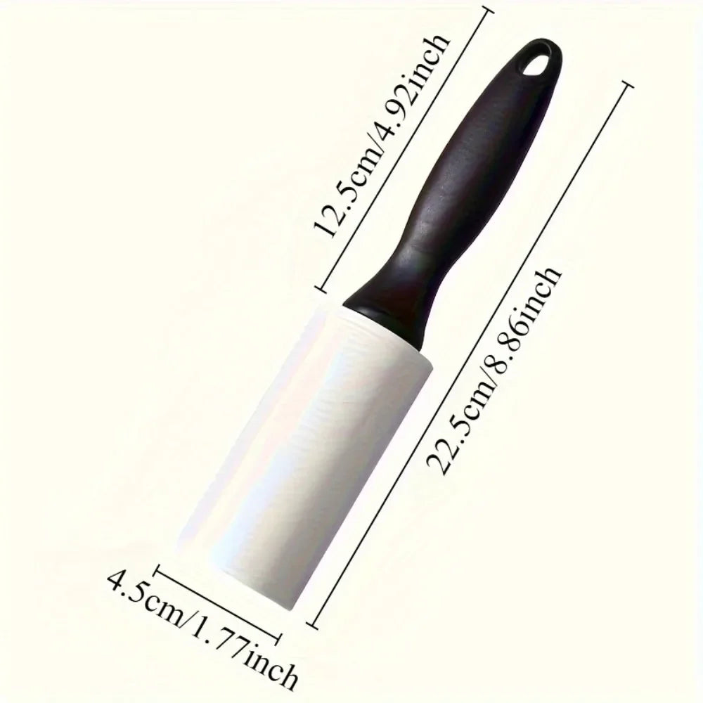 A white adhesive lint roller with a black handle, shown against a white background.