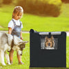 A young girl stands next to a dog while a black waterproof crate cover is displayed.