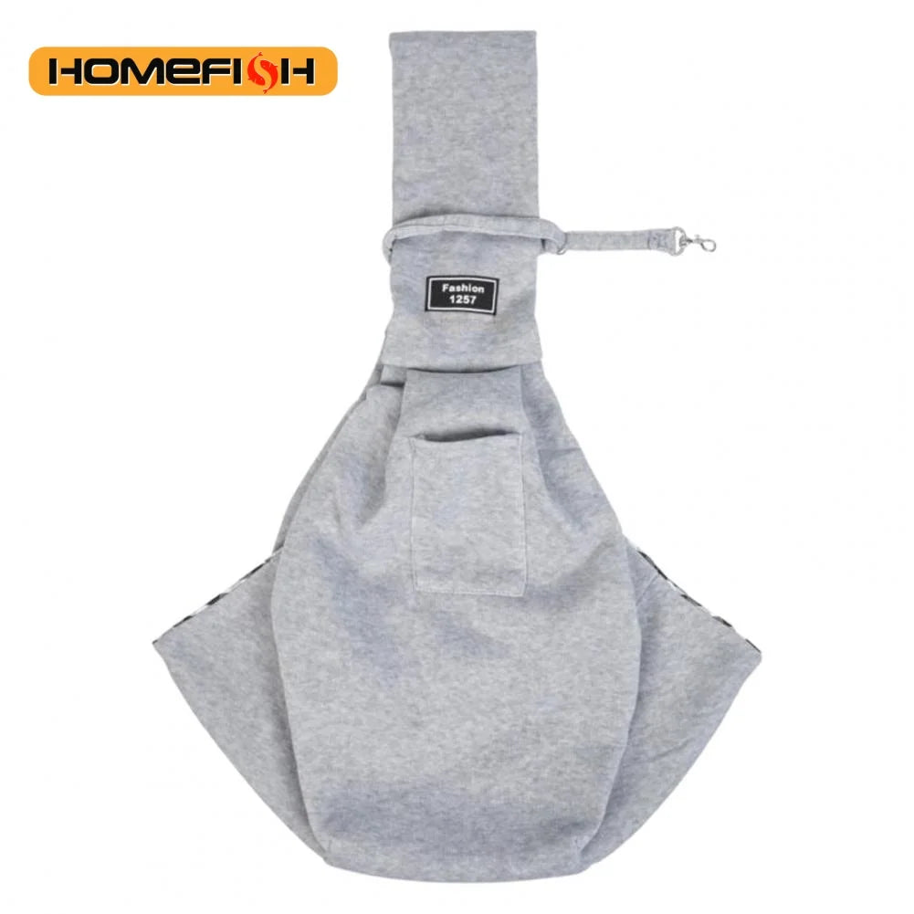 A gray adjustable crossbody dog sling carrier with a fabric pouch and strap.