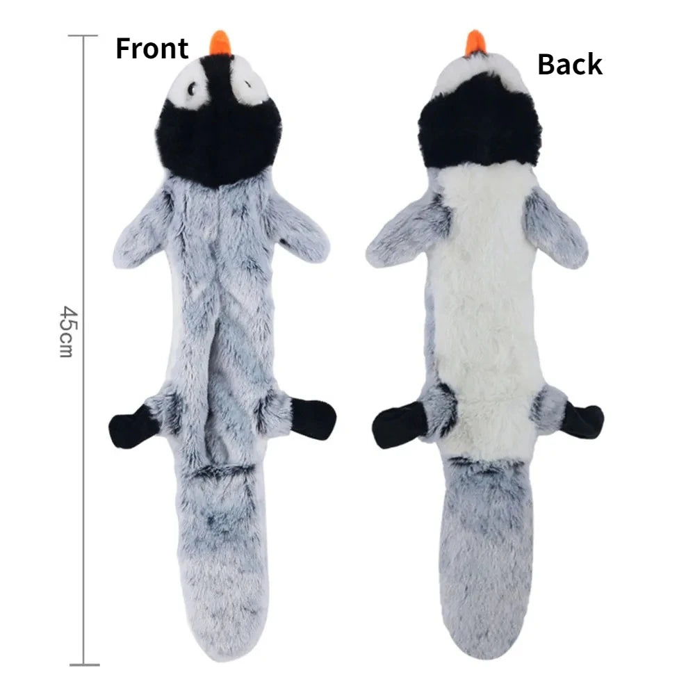 Front and back views of a gray plush dog toy with black markings and an orange nose.