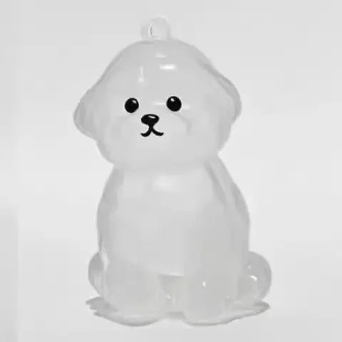 Porte-clés rond en peluche de chien assis pour ranger les poils d'animaux.