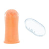 An orange silicone pet toothbrush set for dogs and cats, showing the brush head and a cleaning pad.