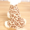 A brown leopard print dog dress with white fluffy trim.
