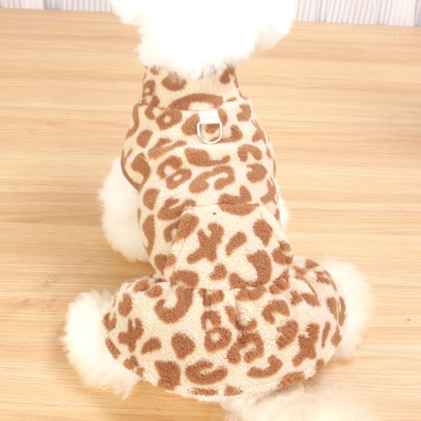 A brown leopard print dog dress with white fluffy trim.