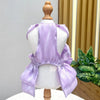 Back view of a lavender satin pet dress with a D-ring for a small dog displayed on a mannequin.