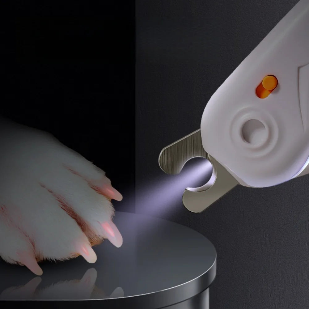 Weißer Nagelschneider für Haustiere schneidet mit Lichtstrahl gegen dunklen Hintergrund.