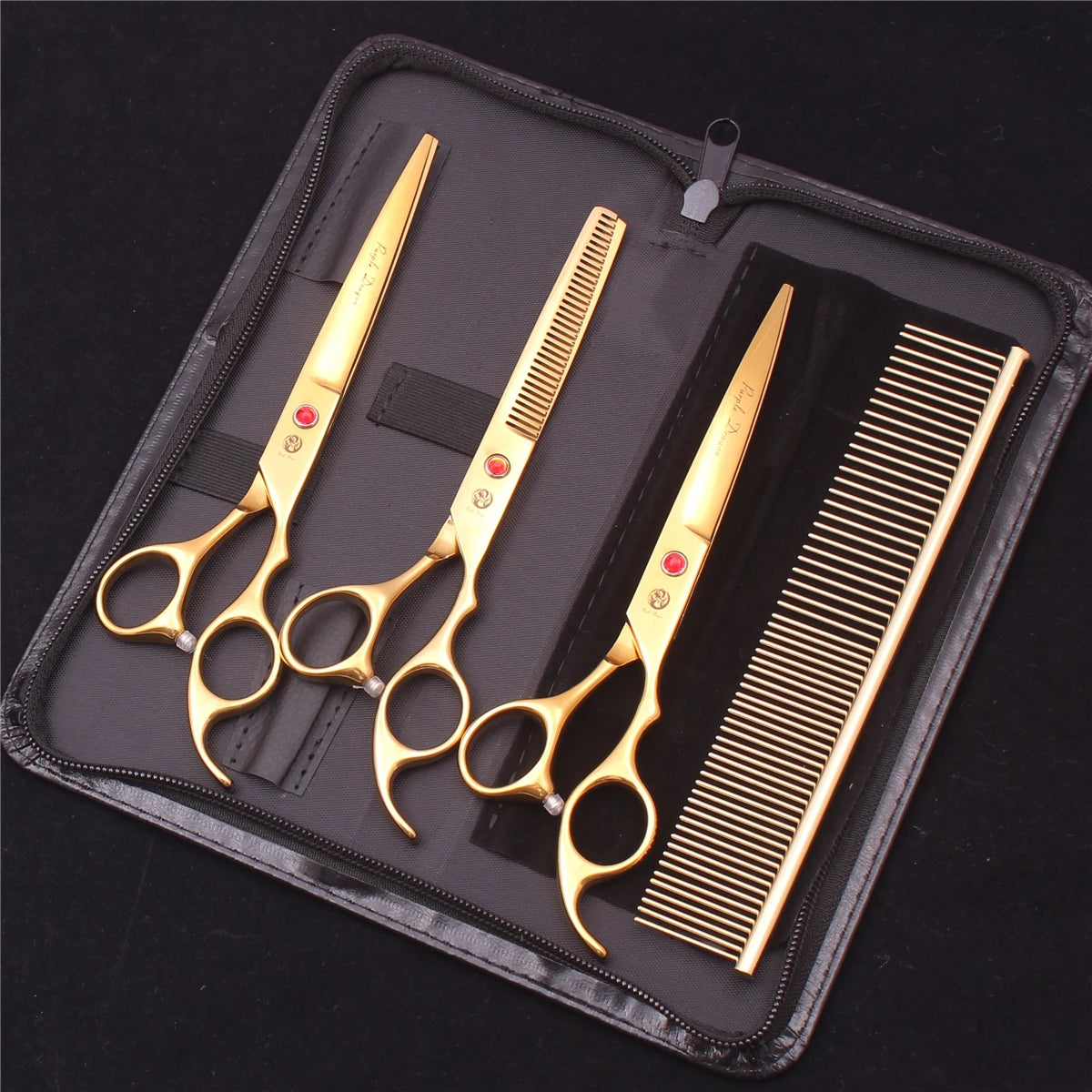 A set of professional stainless steel pet grooming scissors and a comb displayed in a black zippered pouch.