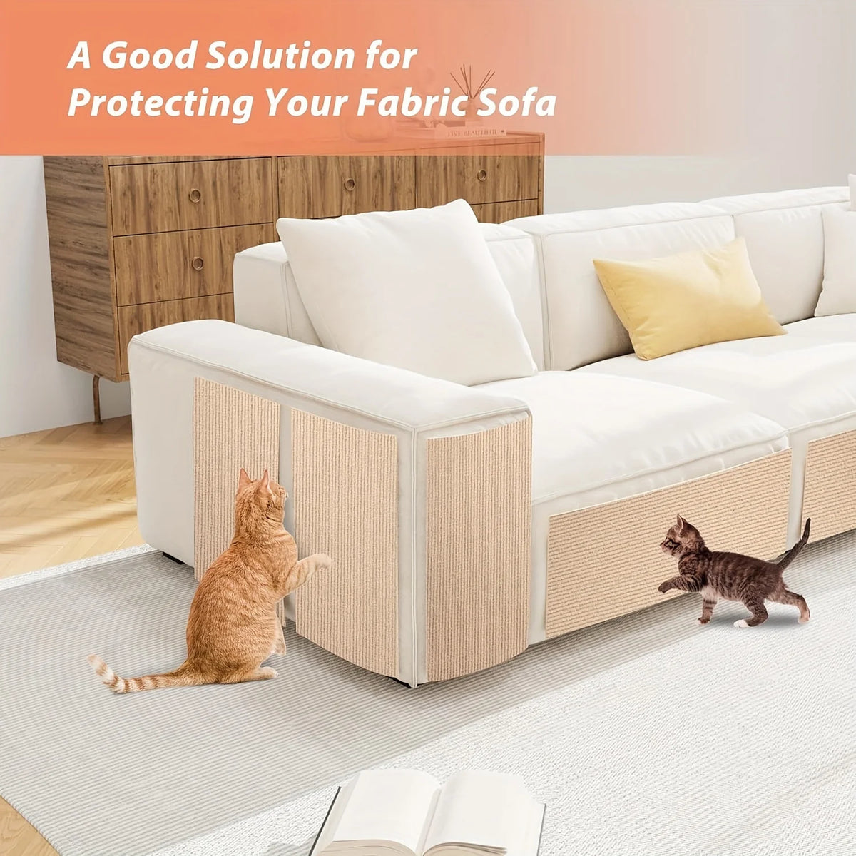 A white fabric sofa with beige protective covers is shown on a light rug with a cat nearby.