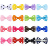 Colección de clips y lazos de pelo colorido para el aseo de perros y gatos, con diversas formas y colores.
