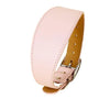 A pink wide leather dog collar with a brass buckle and tan leather strap.