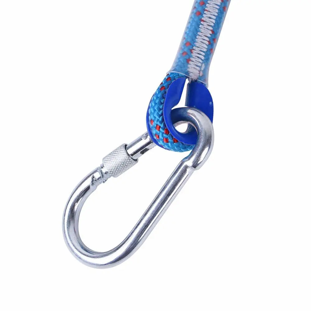 A close-up of a durable bite-resistant dog spring pole toy featuring a blue and white patterned cotton rope and silver metal 