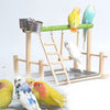 A wooden multi-level bird activity center featuring a perch, hammock, and platform for birds.