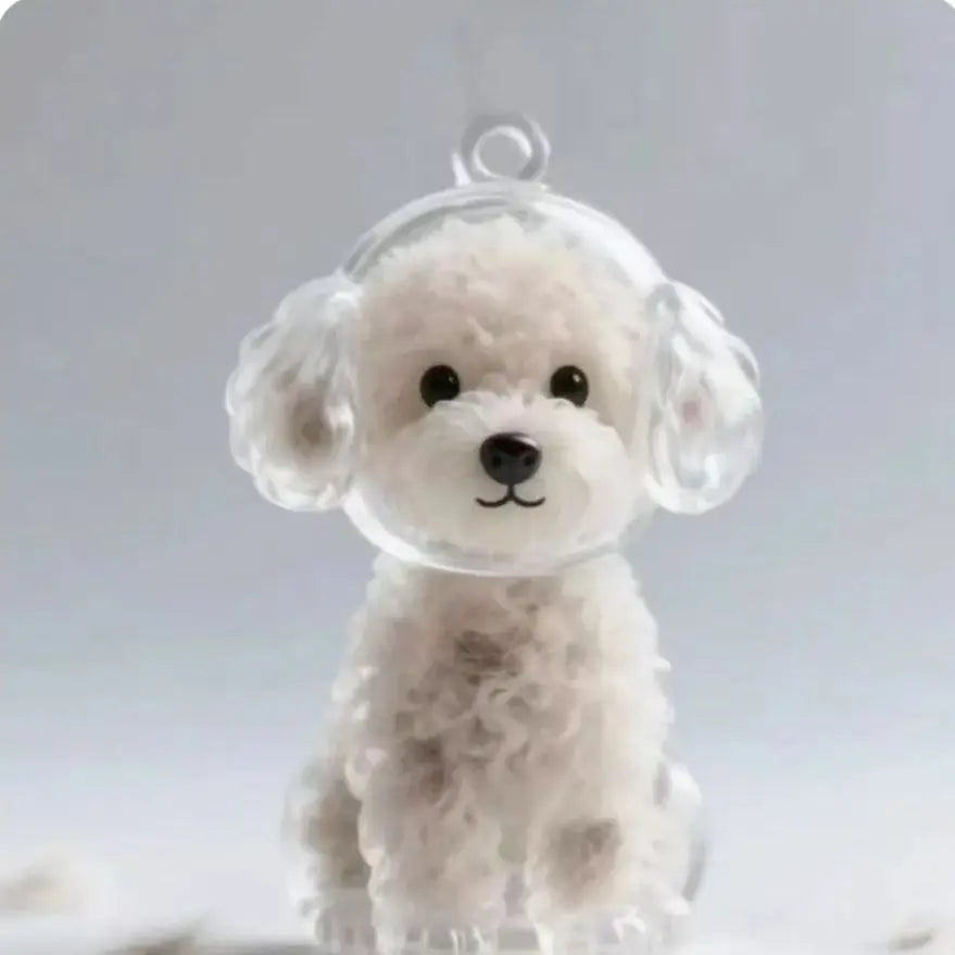 A clear resin keychain shaped like a fluffy white dog, memorializing pet hair.