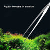 Stainless steel aquarium cleaning tweezers shown above lush green aquatic plants and fish.