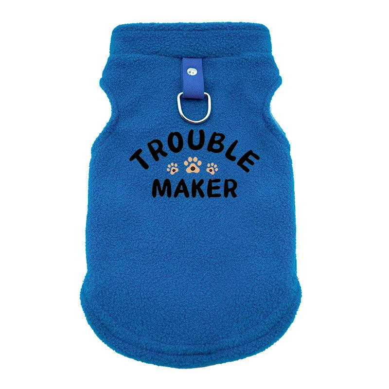 A bright blue, fuzzy pet jacket for dogs with a silver metal clasp.