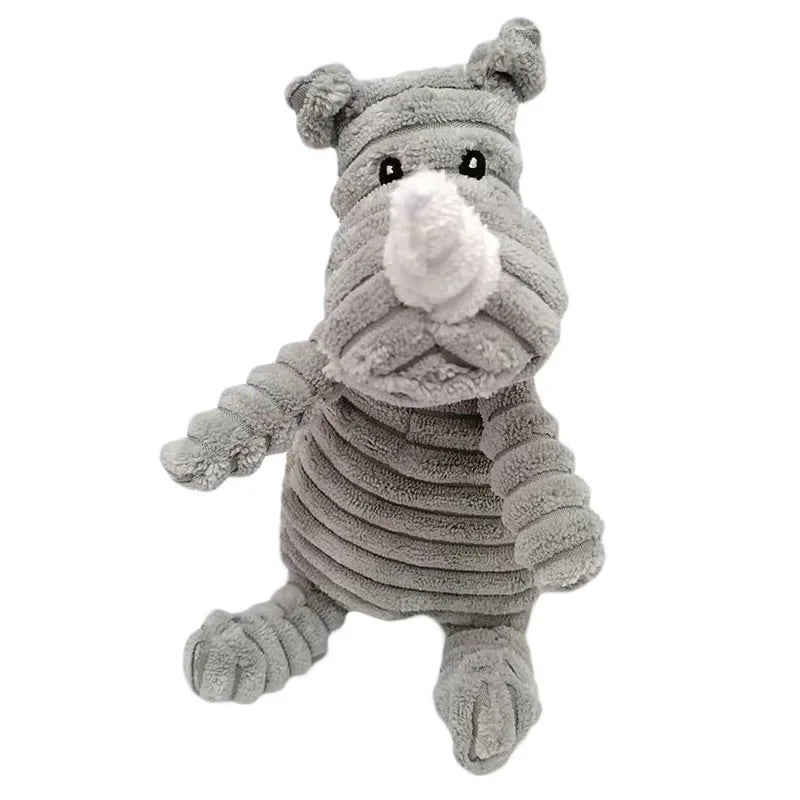 A gray corduroy squeaky dog toy shaped like a stylized elephant.